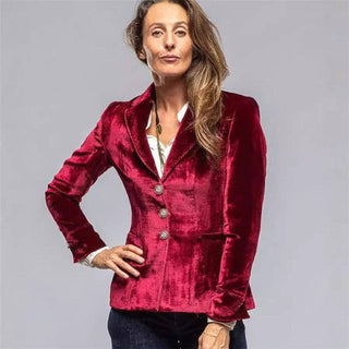 Front view of short wine velvet blazer styled with jeans