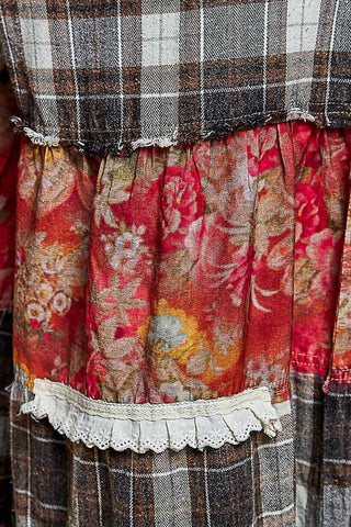 Close-up of plaid, red floral and white ruffle trim patchwork