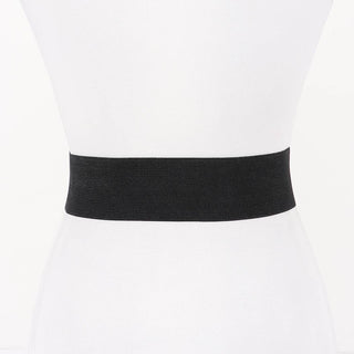 Hammered metal buckle close-up on studded suede belt
