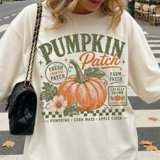 Close-up of Pumpkin Patch graphic with orange pumpkin and sage lettering