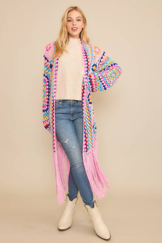 Colorful crochet granny square fringe cardigan duster styled with jeans