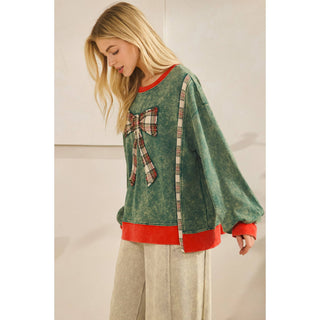 Plaid bow pullover styled with cream wide-leg pants