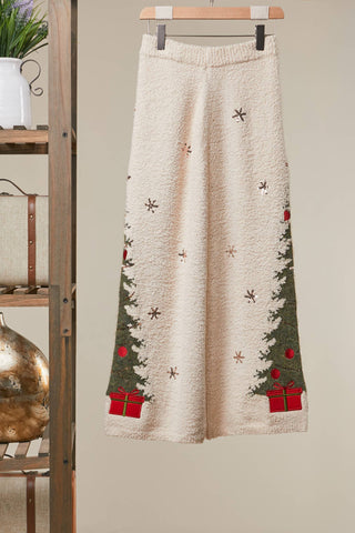Side view of Christmas tree sweater pants