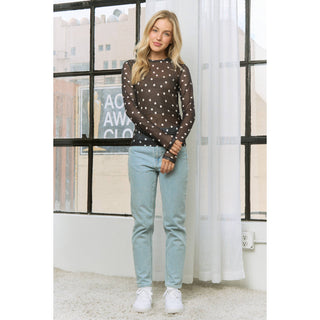 Sheer polka dot mesh long sleeve top styled with jeans