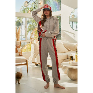 Grey hoodie and jogger set with leopard side panels, standing
