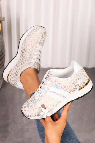 Ivory leopard print low-top sneaker with gold-tone heel accent, side view