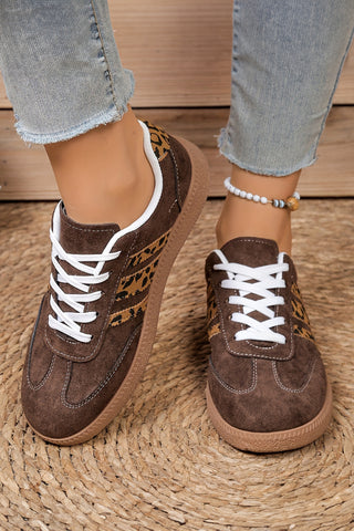 Pair of Coffee House luxe leopard patchwork sneakers in coffee brown