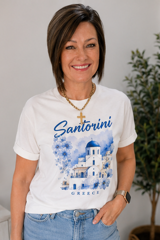 Woman wearing a white t-shirt with Santorini Greece design