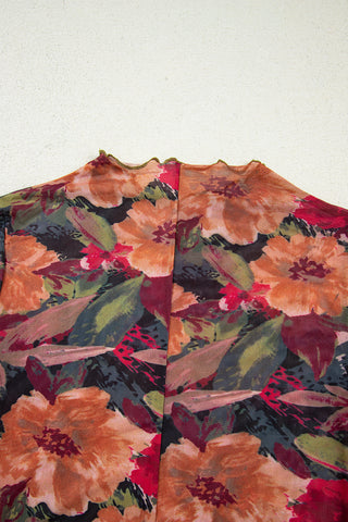 Olive lettuce edge ruffle trim detail at sleeve cuff of floral mesh top
