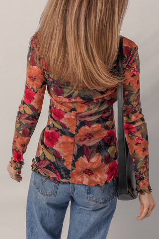 Back view of floral mesh top showing center seam and lettuce edge hem
