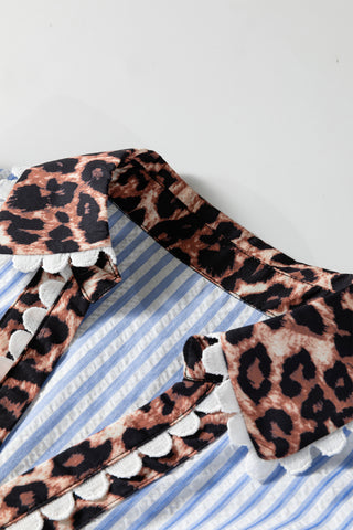 Folded fabric with leopard print trim on a white background