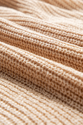 Flat lay detail of soft acrylic knit fabric in toasted almond beige