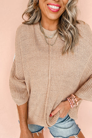 Almond beige 3/4 sleeve sweater showing drape and length over jeans