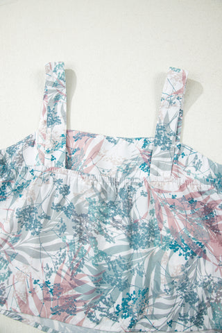 Floral patterned dress with straps on a white background