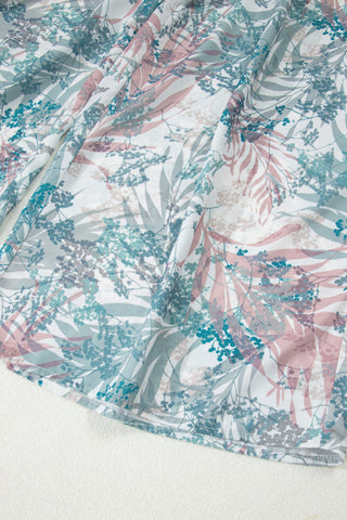 Textile with abstract pattern of pink, blue, and gray on a white background