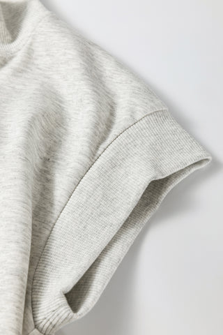 Close-up of a gray sweater on a light gray background