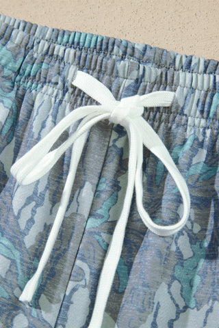 Close-up of blue abstract floral print fabric on the Blue Muse set