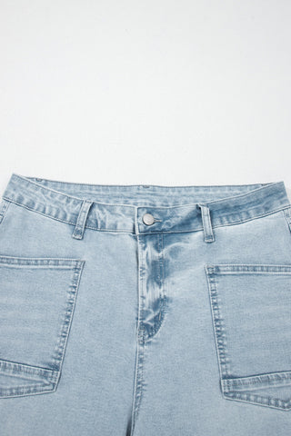 Light blue denim jeans on a white background