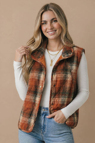 Quilted rust plaid vest with snap button front and pockets