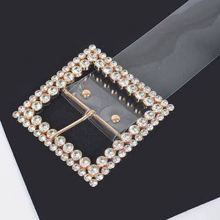 Close-up of sparkling square rhinestone belt buckle