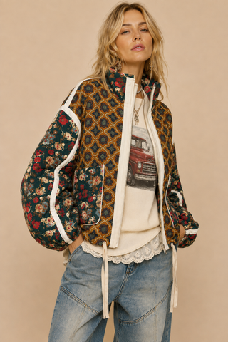 Front Porch Patchwork Bomber quilted jacket in Toffee Garden, front view with jeans