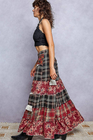 Profile view of tiered patchwork wide leg pants with ruffle trim