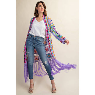 Colorful crochet granny square fringe cardigan duster styled with jeans