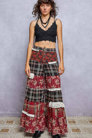 Full-length look of plaid and floral patchwork wide leg pants with black top