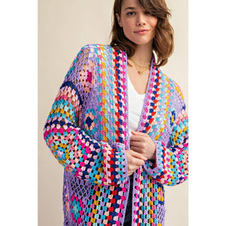 Colorful crochet granny square fringe cardigan duster styled with jeans