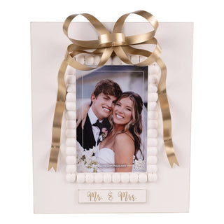 Mr. & Mrs. picture frame with gold ribbon bow and white beaded border