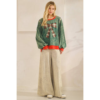 Oversized holiday bow pullover in spruce green