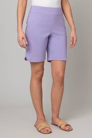 Person wearing light purple shorts on a plain background