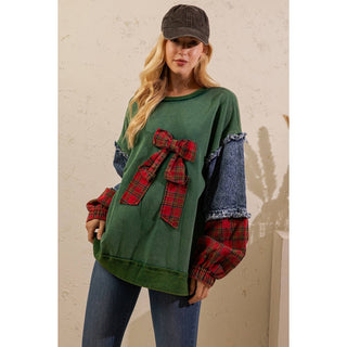 Green pullover with plaid cuffs and denim sleeve panels