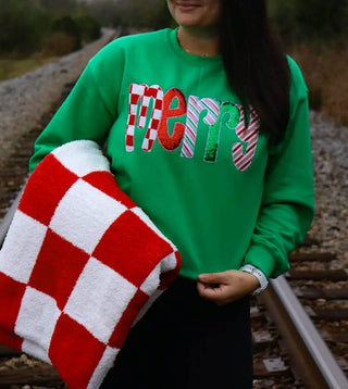 Green merry sweatshirt with red and white check and sequin appliqué letters