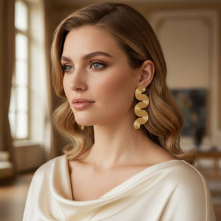 The Modern Muse Wavy Statement Earrings – Gold