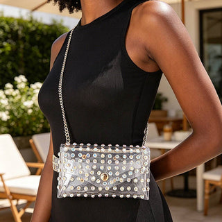 Stadium Sparkle clear rhinestone belt bag worn crossbody on a gold chain