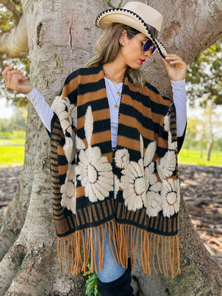 Back view of striped ruana with oversized ivory floral applique