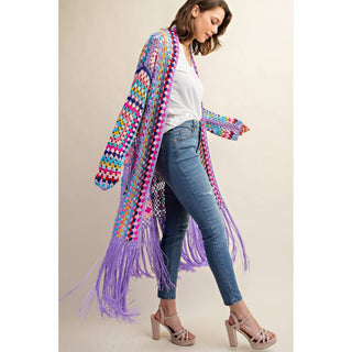 Colorful crochet granny square fringe cardigan duster styled with jeans