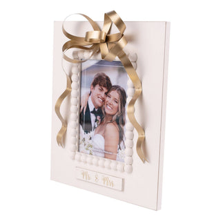 Angled view of Mr. & Mrs. gold bow wedding photo frame