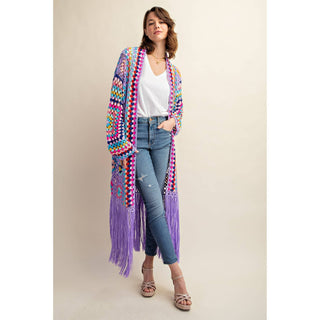 Colorful crochet granny square fringe cardigan duster styled with jeans
