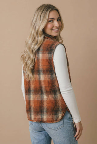 Back view of rust plaid quilted puffer vest