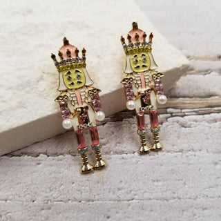 Pink nutcracker earrings with gold crowns and pearl details