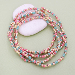 Peaches and cream beaded stretch bracelet stack in pink, aqua, cream and gold glass beads