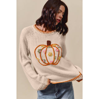 Pumpkin floral embroidered sweater styled with dark jeans