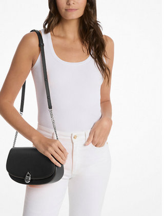 Michael Kors Mila Medium East-West Sling Messenger in black worn crossbody